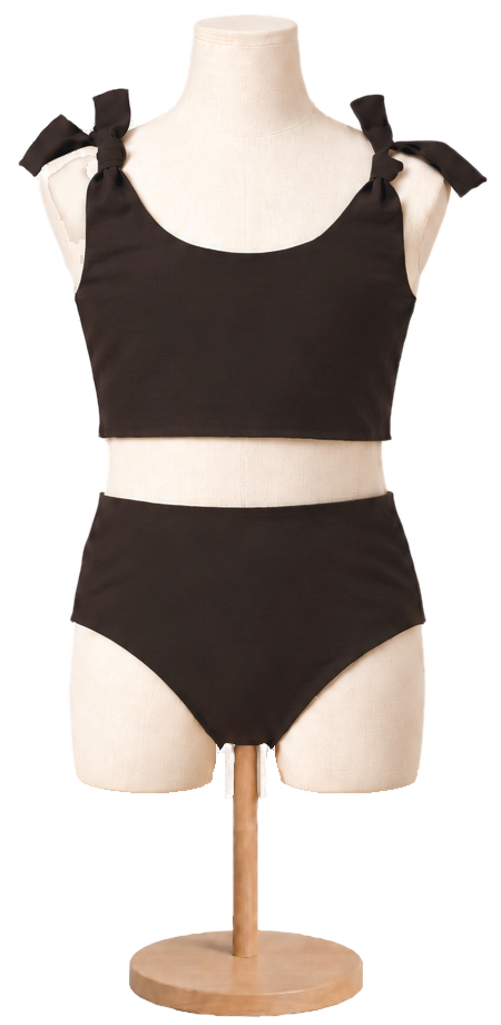 Matching girls' cotton swimsuit in Espresso on a child dress form