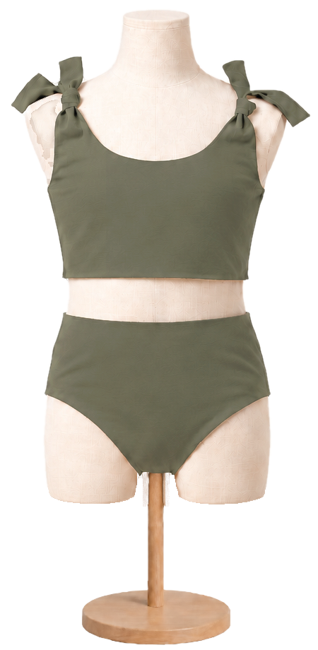 Matching girls' cotton swimsuit in Olive on a child dress form