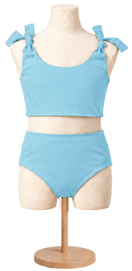 Matching girls' cotton swimsuit in Sky on a child dress form