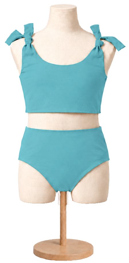 Matching girls' cotton swimsuit in Turquoise on a child dress form