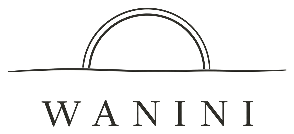 WANINI logo: a sun rising over the shoreline